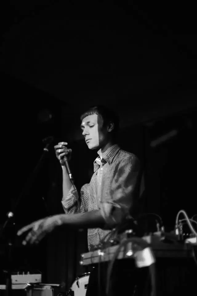 Constantin John performing live, black and white